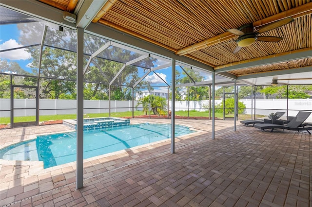 10811 Providence Oaks Dr, Riverview, FL 33578 - view of swimming pool with a fenced backyard, a patio, a ceiling fan, a pool with connected hot tub, and glass enclosure