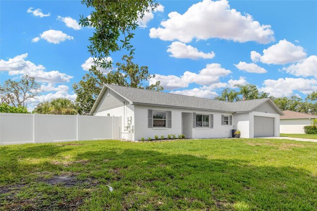 10811 Providence Oaks Dr, Riverview, FL 33578 - ranch-style house featuring an attached garage, driveway, and brick siding