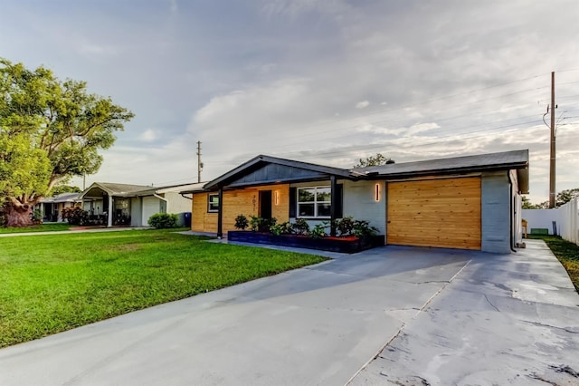 7031 Magnolia Valley Dr, New Port Richey, FL 34653 - view of front facade featuring a garage and driveway