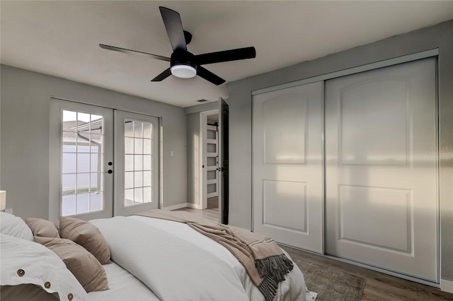 7031 Magnolia Valley Dr, New Port Richey, FL 34653 - bedroom featuring access to outside, wood finished floors, french doors, a ceiling fan, and a closet