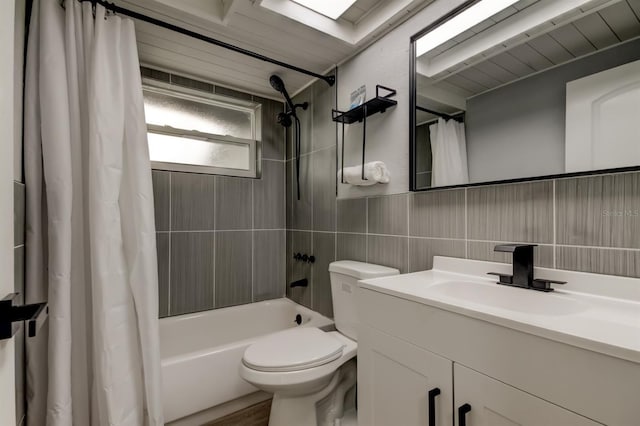 7031 Magnolia Valley Dr, New Port Richey, FL 34653 - full bathroom featuring tile walls, vanity, and shower / tub combo with curtain