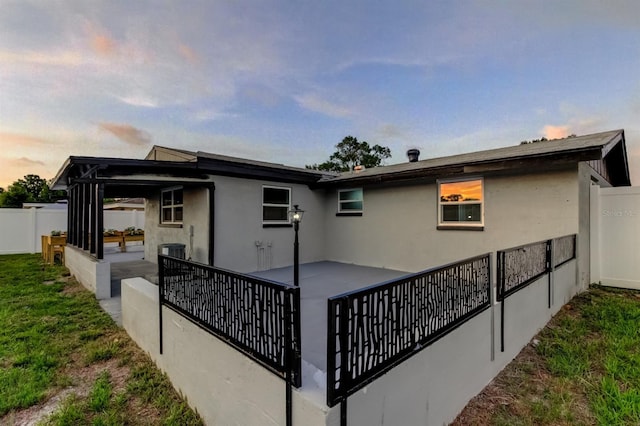 7031 Magnolia Valley Dr, New Port Richey, FL 34653 - rear view of property with a patio and stucco siding