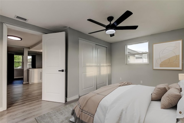 7031 Magnolia Valley Dr, New Port Richey, FL 34653 - bedroom with light wood-style floors and ceiling fan