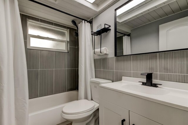 7031 Magnolia Valley Dr, New Port Richey, FL 34653 - full bathroom featuring vanity, shower / bath combo with shower curtain, and tile walls