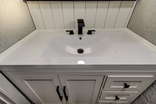 7031 Magnolia Valley Dr, New Port Richey, FL 34653 - bathroom featuring vanity and a textured wall