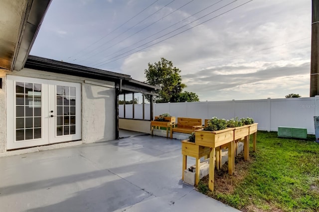 7031 Magnolia Valley Dr, New Port Richey, FL 34653 - view of patio / terrace with french doors