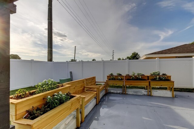 7031 Magnolia Valley Dr, New Port Richey, FL 34653 - view of patio featuring a garden