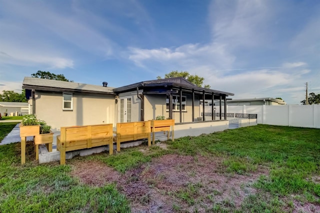 7031 Magnolia Valley Dr, New Port Richey, FL 34653 - rear view of house featuring french doors and stucco siding