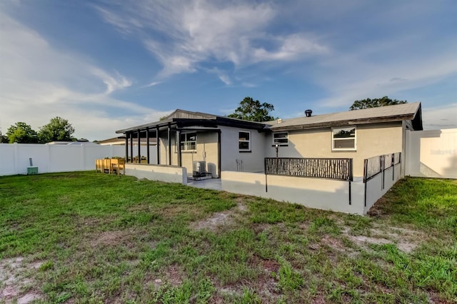 7031 Magnolia Valley Dr, New Port Richey, FL 34653 - rear view of house with stucco siding