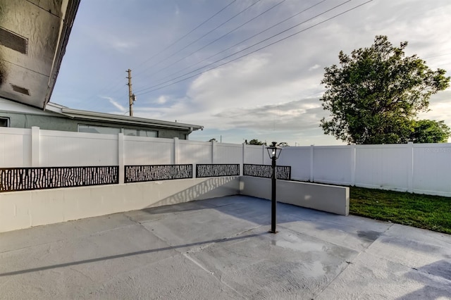 7031 Magnolia Valley Dr, New Port Richey, FL 34653 - fenced backyard featuring a patio area