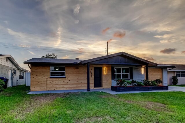7031 Magnolia Valley Dr, New Port Richey, FL 34653 - view of front of property with a front lawn