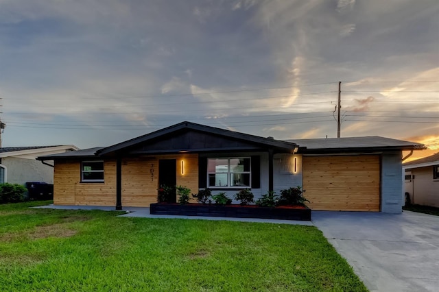 7031 Magnolia Valley Dr, New Port Richey, FL 34653 - ranch-style home featuring concrete driveway, a garage, and a front yard