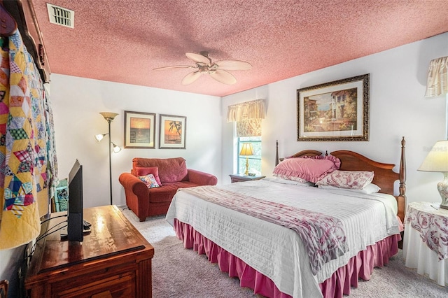 3335 Foxridge Cir, Tampa, FL 33618 - bedroom featuring light colored carpet, ceiling fan, and a textured ceiling