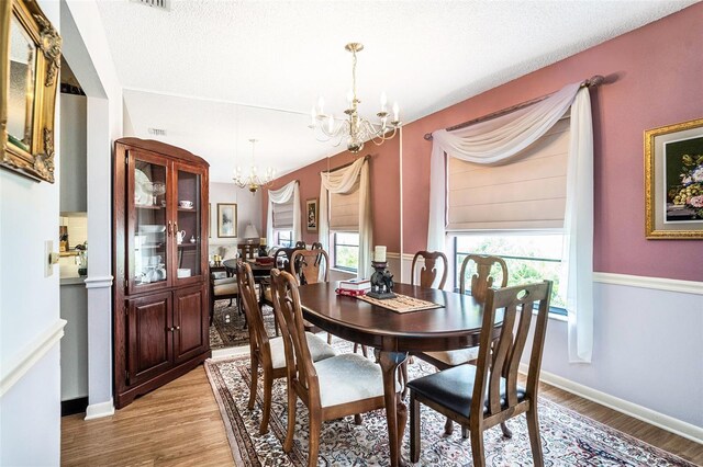 3335 Foxridge Cir, Tampa, FL 33618 - dining space featuring a chandelier and light wood-type flooring