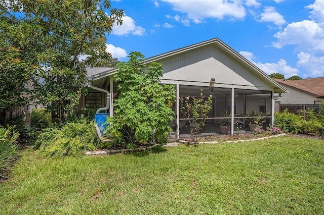 3335 Foxridge Cir, Tampa, FL 33618 - rear view of property with a sunroom