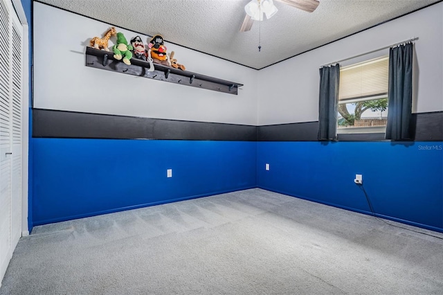 1810 Orange Hill Dr, Brandon, FL 33510 - carpeted empty room with a textured ceiling and ceiling fan