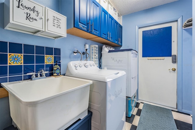 1810 Orange Hill Dr, Brandon, FL 33510 - laundry room with washer and dryer, tile patterned floors, cabinet space, and a textured ceiling