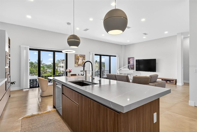 131 Forest Hills Dr, Redington Shores, FL 33708 - kitchen featuring modern cabinets, a kitchen island with sink, stainless steel dishwasher, recessed lighting, and pendant lighting
