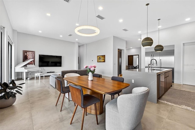 131 Forest Hills Dr, Redington Shores, FL 33708 - dining area with concrete flooring and recessed lighting