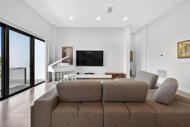 131 Forest Hills Dr, Redington Shores, FL 33708 - living room featuring recessed lighting and tile patterned floors
