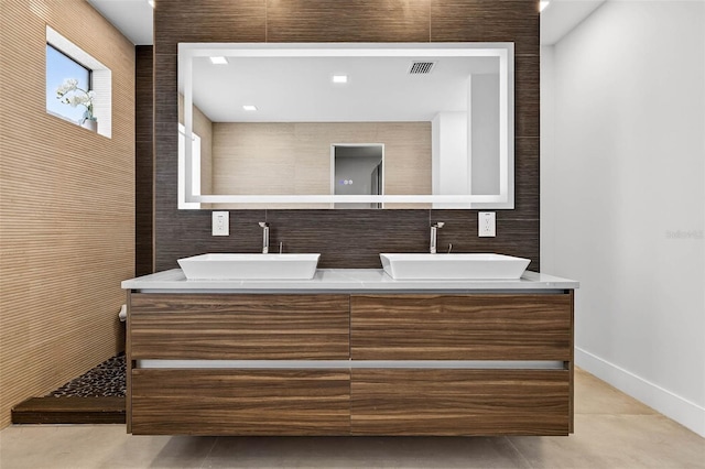 131 Forest Hills Dr, Redington Shores, FL 33708 - full bathroom with double vanity and tile patterned floors