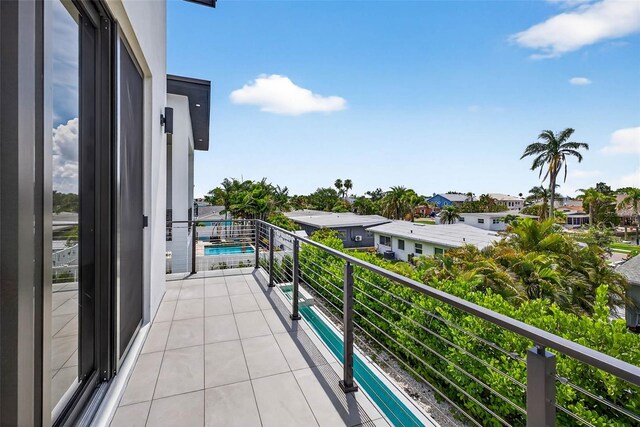 131 Forest Hills Dr, Redington Shores, FL 33708 - balcony featuring view of pool area and a residential view