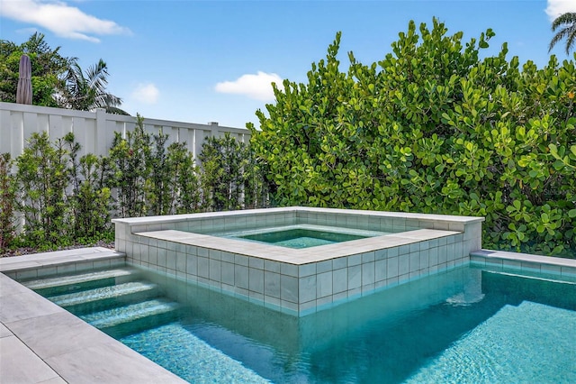 131 Forest Hills Dr, Redington Shores, FL 33708 - view of swimming pool featuring a pool with connected hot tub