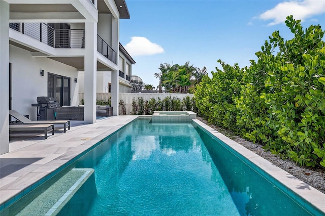 131 Forest Hills Dr, Redington Shores, FL 33708 - view of swimming pool featuring a grill, a patio, a pool with connected hot tub, and an outdoor hangout area