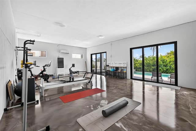 131 Forest Hills Dr, Redington Shores, FL 33708 - exercise room featuring a wall unit AC