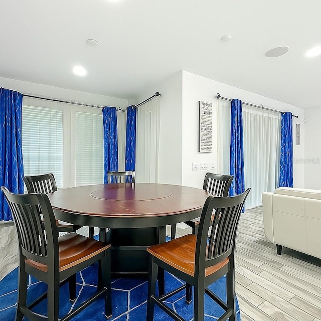 1138 Fountain Coin Loop, Orlando, FL 32828 - dining space with light wood finished floors