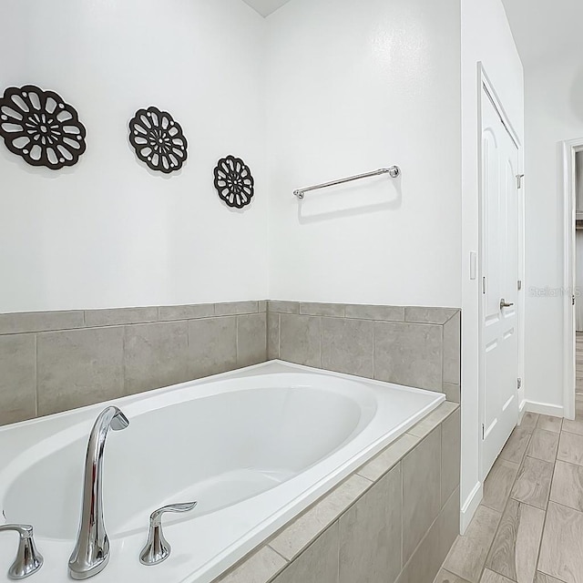 1138 Fountain Coin Loop, Orlando, FL 32828 - full bath with a garden tub and baseboards