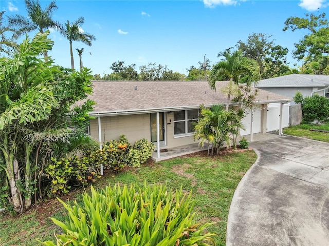 11460 Park Blvd, Seminole, FL 33772 - single story home featuring concrete driveway and roof with shingles
