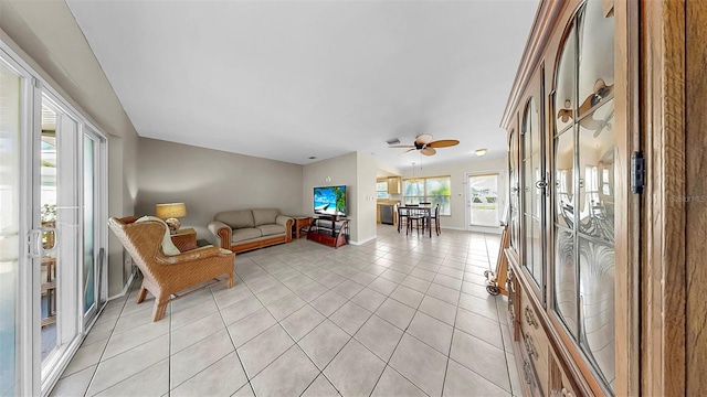 11460 Park Blvd, Seminole, FL 33772 - living room featuring light tile patterned floors and ceiling fan
