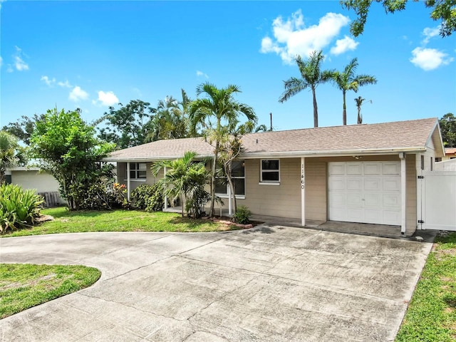 11460 Park Blvd, Seminole, FL 33772 - ranch-style house featuring driveway and a garage