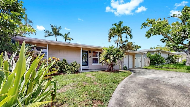 11460 Park Blvd, Seminole, FL 33772 - single story home with a front yard, driveway, and a garage