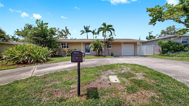 11460 Park Blvd, Seminole, FL 33772 - ranch-style house with driveway, a garage, and a gate