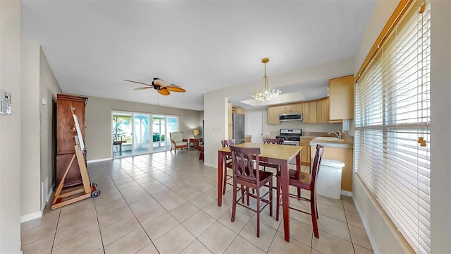 11460 Park Blvd, Seminole, FL 33772 - dining space featuring ceiling fan and light tile patterned floors
