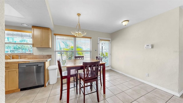 11460 Park Blvd, Seminole, FL 33772 - dining space with healthy amount of natural light, a chandelier, and light tile patterned flooring