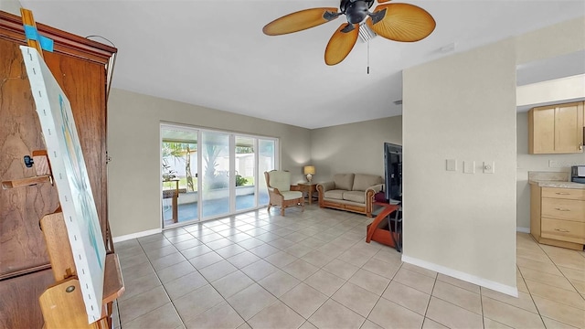 11460 Park Blvd, Seminole, FL 33772 - living area with light tile patterned flooring and a ceiling fan