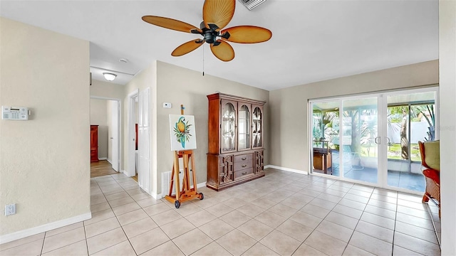 11460 Park Blvd, Seminole, FL 33772 - empty room with a ceiling fan and light tile patterned flooring