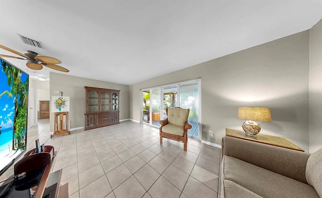 11460 Park Blvd, Seminole, FL 33772 - living area with light tile patterned floors and ceiling fan