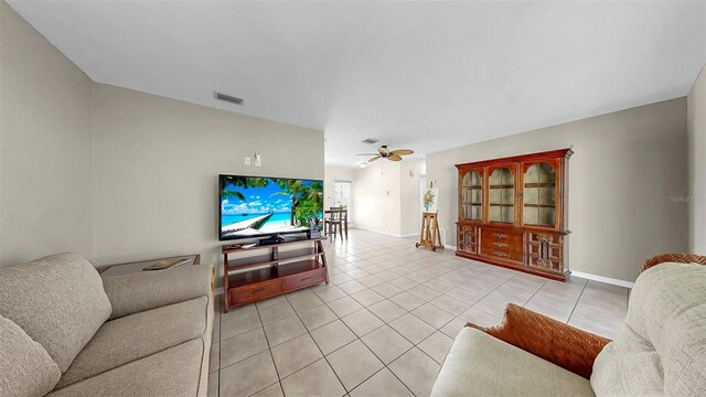 11460 Park Blvd, Seminole, FL 33772 - living area featuring light tile patterned flooring and a ceiling fan