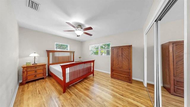 11460 Park Blvd, Seminole, FL 33772 - bedroom with light wood-style floors, a closet, and ceiling fan