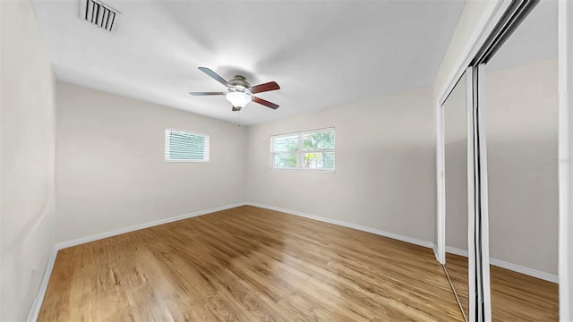 11460 Park Blvd, Seminole, FL 33772 - unfurnished bedroom featuring light wood-style flooring, a closet, and ceiling fan