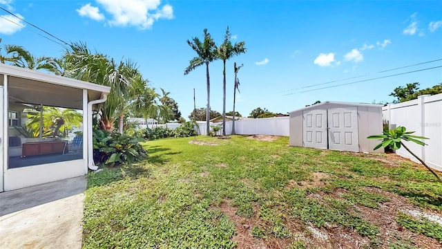 11460 Park Blvd, Seminole, FL 33772 - fenced backyard featuring a storage unit and a sunroom