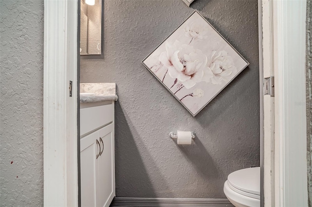 1518 Louise Ave, Auburndale, FL 33823 - half bath featuring vanity, a textured wall, and wood finished floors