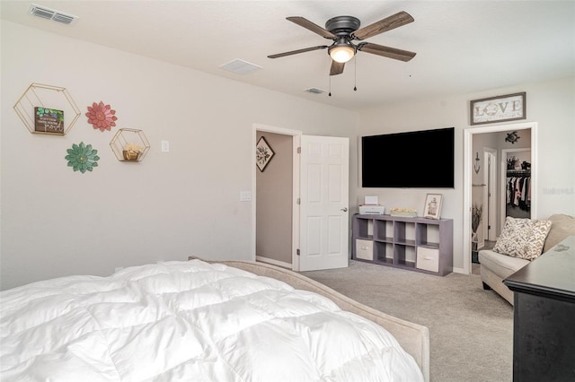 1518 Louise Ave, Auburndale, FL 33823 - bedroom featuring light colored carpet, a spacious closet, ceiling fan, and a closet