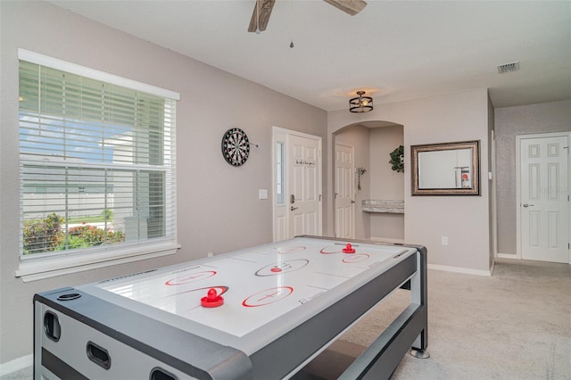 1518 Louise Ave, Auburndale, FL 33823 - rec room with light carpet, ceiling fan, and arched walkways