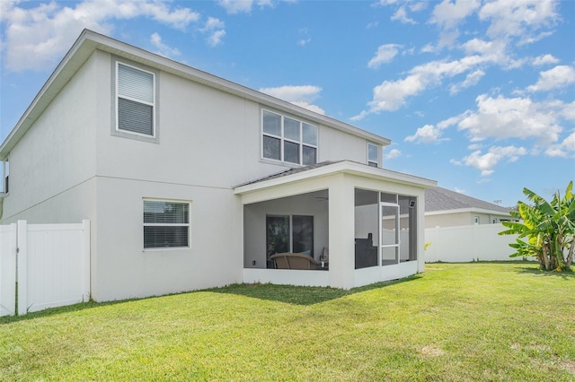 1518 Louise Ave, Auburndale, FL 33823 - back of house with stucco siding and a sunroom