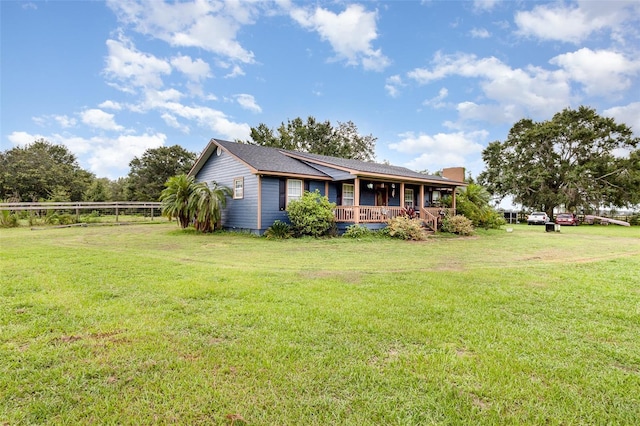 2410 Thornton Rd, Zolfo Springs, FL 33890 - view of front of home featuring a porch and a front lawn